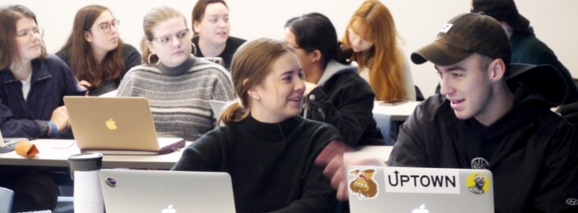 Image of students working in groups in class